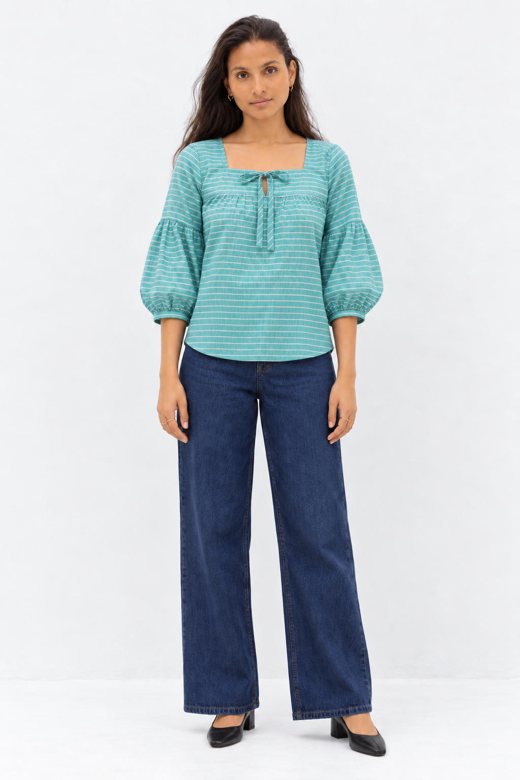 Green and white striped balloon sleeve top styled with denim