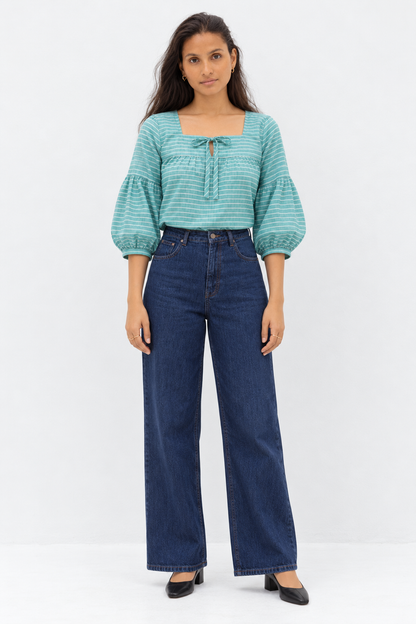 Close up of tie front and gathered yoke on seafoam striped blouse