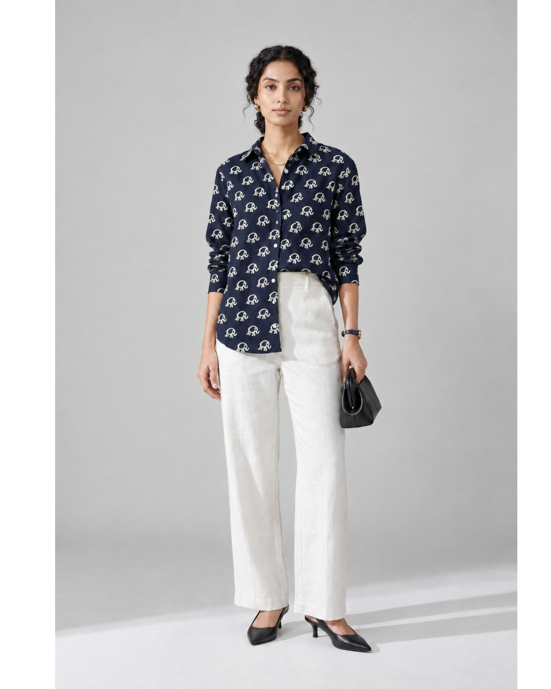 Navy Elephant Print pure cotton shirt styled with white trousers, full-frame front view
